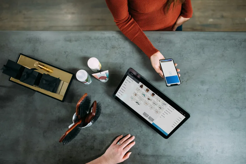 A table with a laptop and tablet